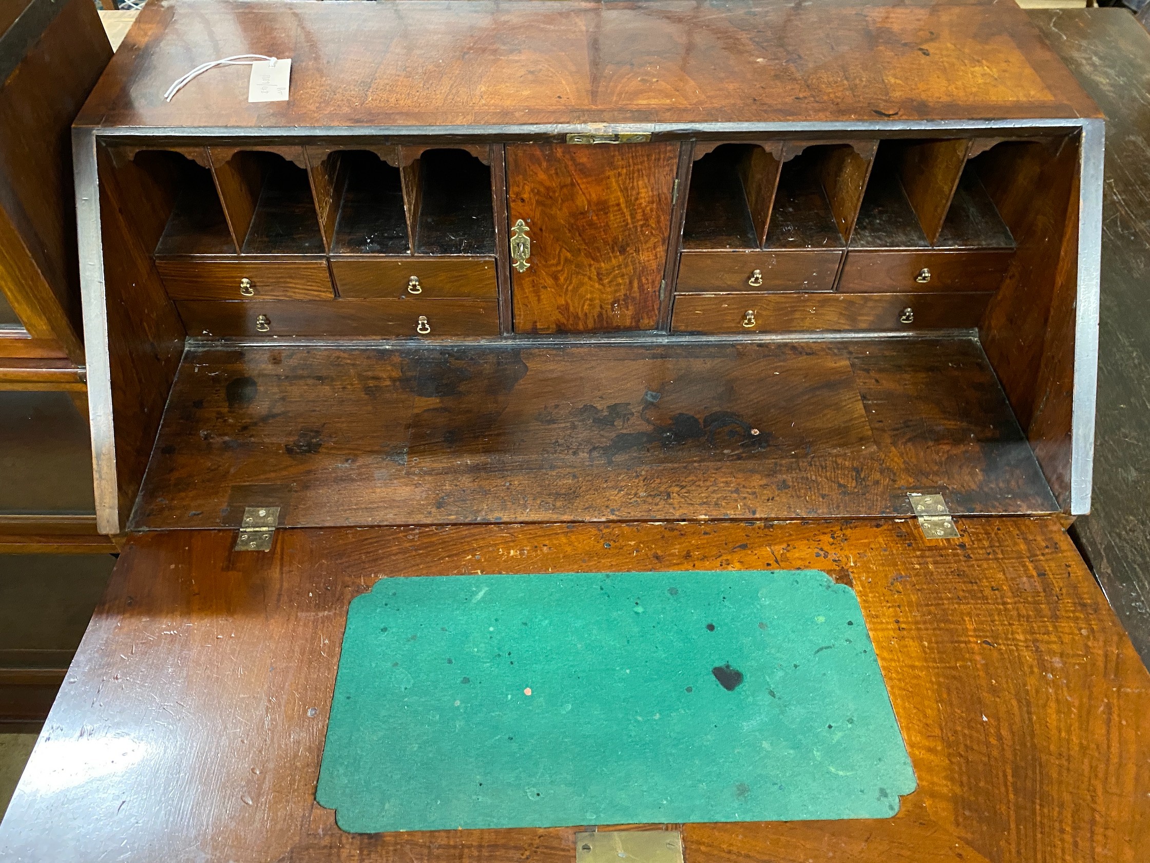 An 18th century feather banded walnut bureau, width 92cm, depth 51cm, height 108cm